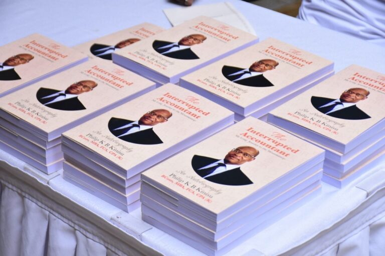 Copies of The Interrupted Accountant by Philip Kinisu, a recent Free Press Publishers release, laid on a table during the launch.