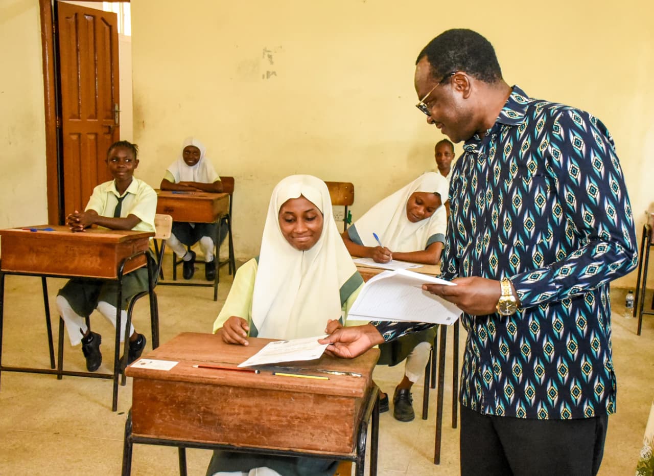 Julius Migos Ogamba speaks with a Kenya Certificate of Secondary Education (KCSE) candidate on November 12, 2025. Picture/Courtesy